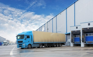 depositphotos_44030229-stock-photo-unloading-cargo-truck-at-warehouse 1